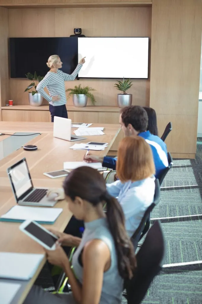 Colleagues at conference table during business meeting